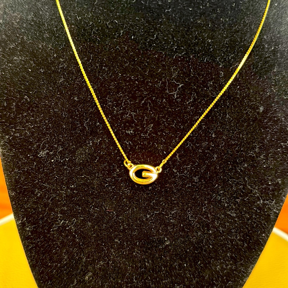 Givenchy small G logo, gold plated.